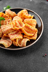 Chips bacon crispy rashers corn snacks fast food natural food fresh dish on the table rustic food top view copy space