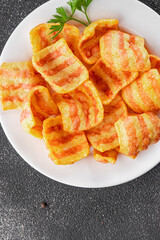 Chips bacon crispy rashers corn snacks fast food natural food fresh dish on the table rustic food top view copy space