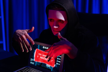 Criminal anonymous mask successful making password encryption by programming hack on laptop of...
