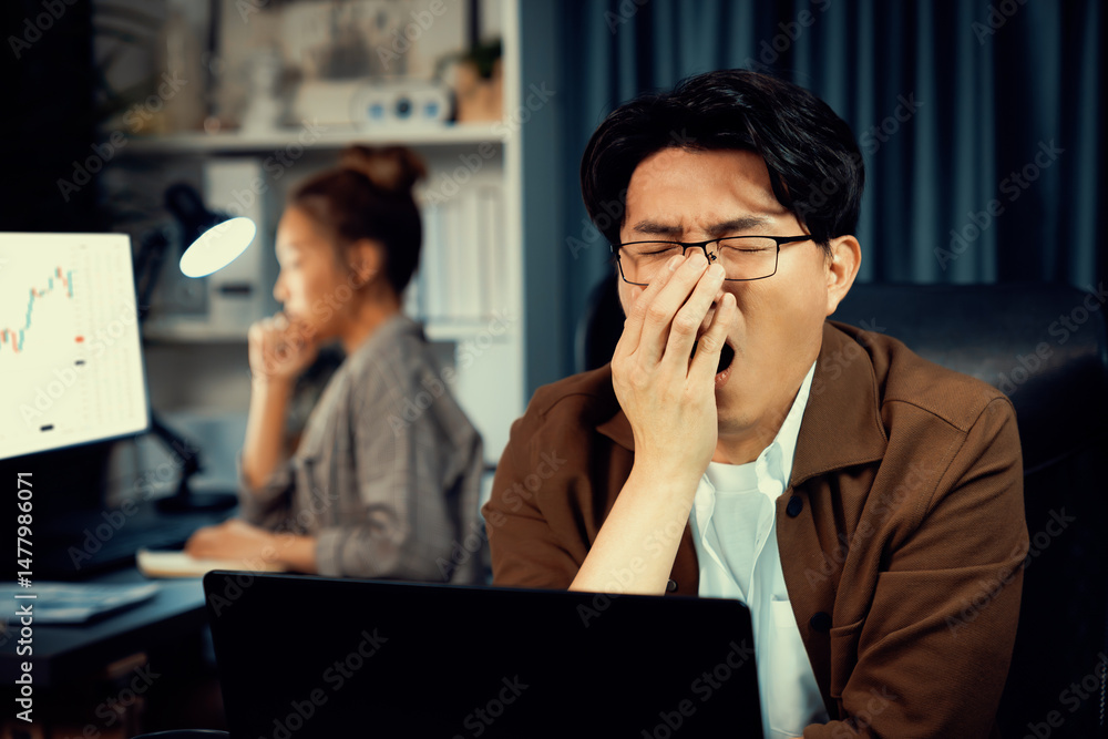 Aufkleber working businessman feeling extremely sleepy with yawning while working on desk with unfinished proj