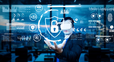 Project manager holding security system hologram and standing at futuristic office with blue glowing color. Business man using augmented reality technology to connect and verify identity. Ingenuity.