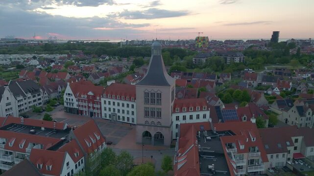 Sunset Orbit Around Tall Character Building with Heist in the Background | FlyLens 4K