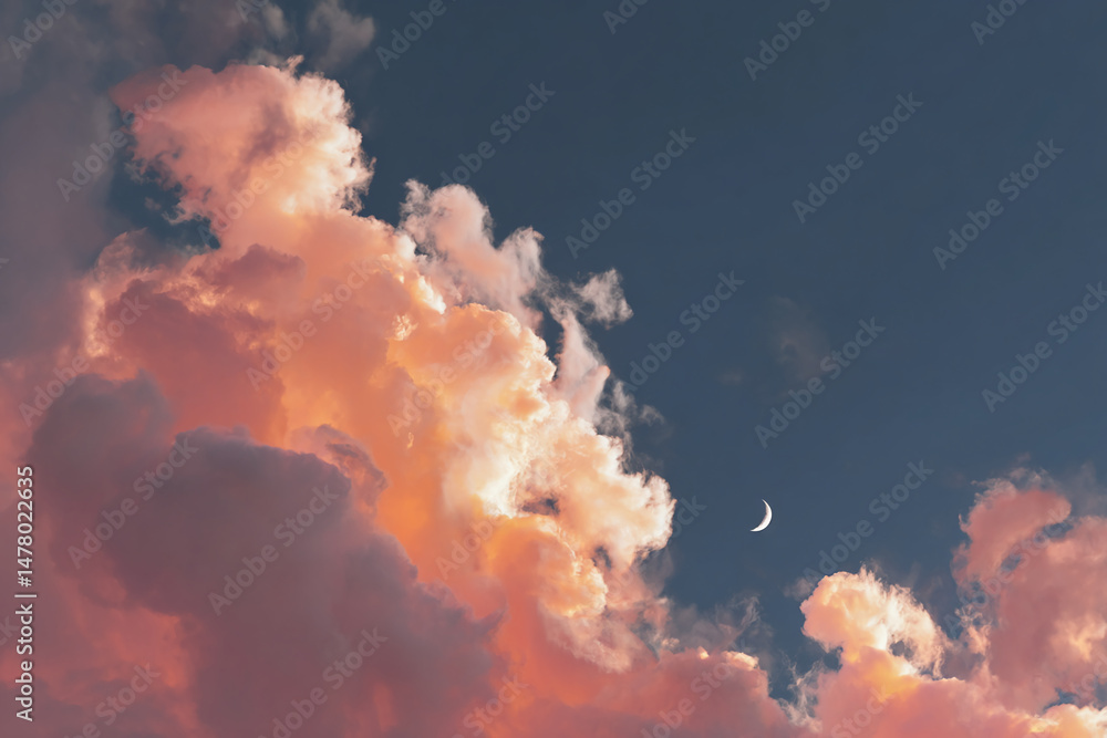 Poster peach-colored clouds fill most of the frame, with a crescent moon visible in the upper right corner,