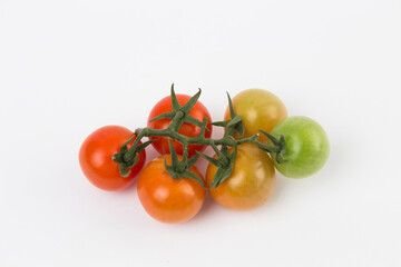 Yellow, Red, and Green Tomatoes on White Background