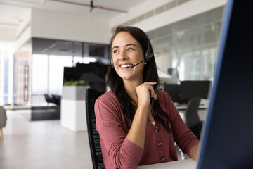 Digital age office worker. Happy young lady contact center agent client support manager in...