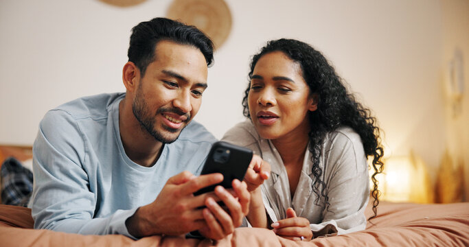 Couple, relax and browsing with phone on bed for social media, online streaming or entertainment at home. Man, woman or lovers lying in bedroom with mobile smartphone for network connection at house
