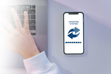 Smartphone Updating System Interface with Laptop and Hand
