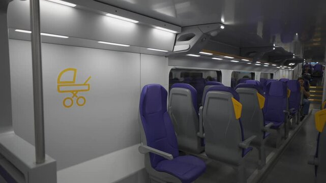 The interior of a modern double-decker Trenitalia Hitachi Caravaggio FNM train in Rome, Italy. Inside view of the new contemporary two-decker electric railway vehicle Hitachi Rail Italy 