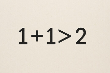 Creative Equation 1+1>2 Symbolizing Synergy and Teamwork on White Background