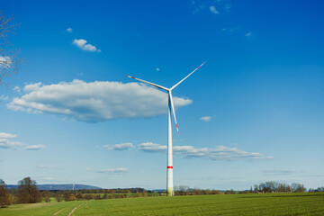 The Renewable Energy Solution A Wind Turbine Efficiently Generating Clean Electricity Amidst a...