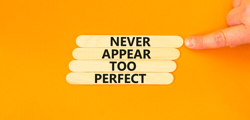 Never appear too perfect symbol. Concept words Never appear too perfect on beautiful wooden sticks. Beautiful orange table orange background. Business and never appear too perfect concept. Copy space.