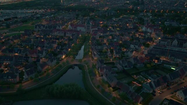Nighttime Drone Flight Over Heulebrug with Streetlights and Water | FlyLens 4K