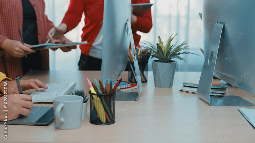 Poster a vibrant office scene showcasing a diverse group of professionals engaged in collaborative discussi