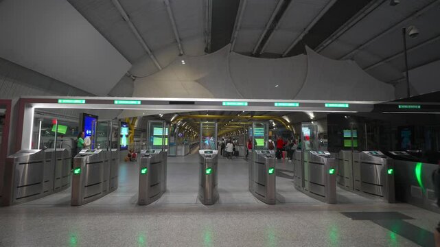 Turnstile for passage and fare payment in Italy, Rome station at airport. Contactless payment for train fare. Entrance gate with fare validation at railroad station in Europe. Transport payment system