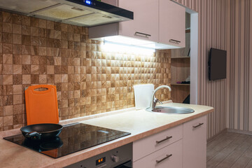 Modern interior of a bright spacious kitchen