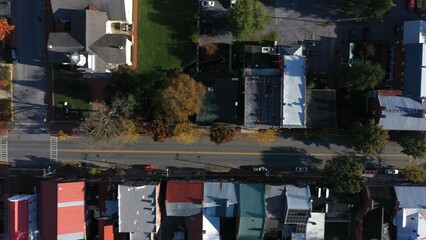 Aerial camera looking straight down at the roofs of houses in Shepherdstown, WV on an autumn...