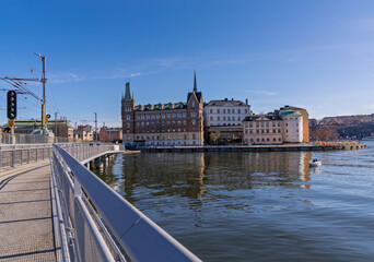 Historic Riddarholmen buildings seen from modern bridge