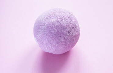 Aromatic purple bath bomb for home spa and relaxation.