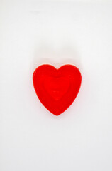 Obraz premium Handmade red soap in the shape of a heart.