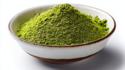 Matcha green tea powder in ceramic bowl on white background close-up photo.