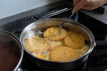 Frying Up Delicious Golden Brown Bread Slices in a Hot Pan for a Tasty Treat or Meal