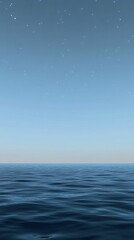 Fototapeta premium Starry night sky over calm, dark ocean.