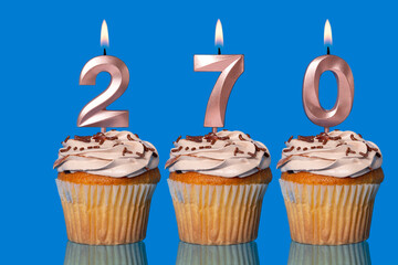 Birthday Cupcakes With Candles Lit Forming The Number 270.