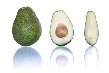Fresh avocado whole and halved, showing creamy green flesh and seed. Ripe tropical fruit isolated on white background. Superfood, healthy fat, vegan ingredient, perfect for guacamole.