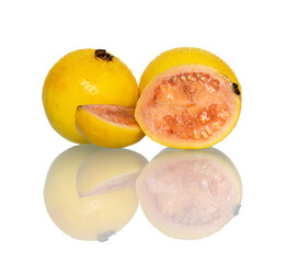 Vivid yellow guavas; one sliced to reveal vibrant pink-red flesh and seeds. Water droplets glisten...