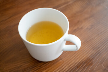 cup of herbal tea on wooden table
