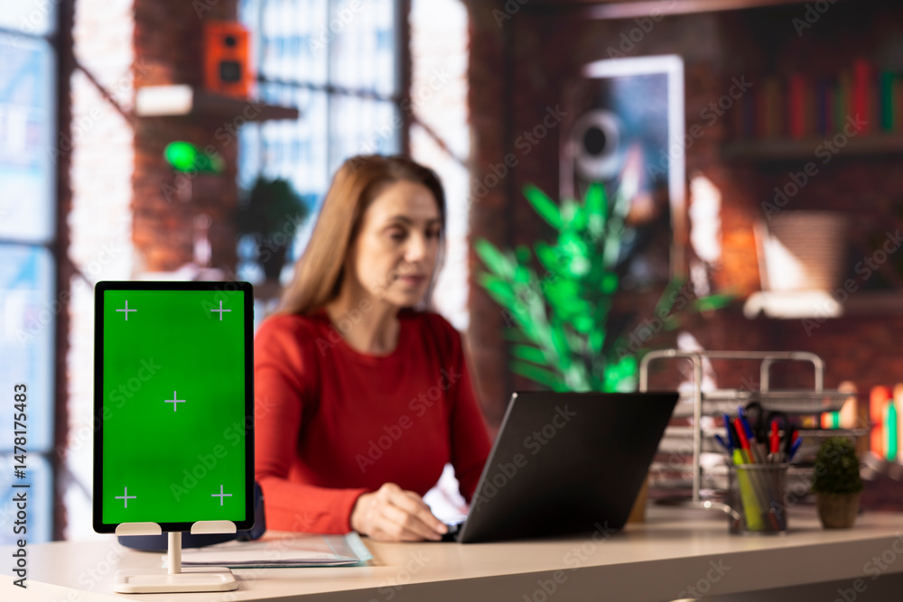 Poster tech savvy user working on pc to test a software next to green screen, navigating new digital tools 