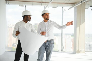engineers team are discussing while inspecting at construction site