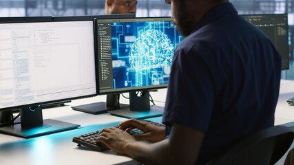 African american worker in data center implements advanced AI driven predictive maintenance...