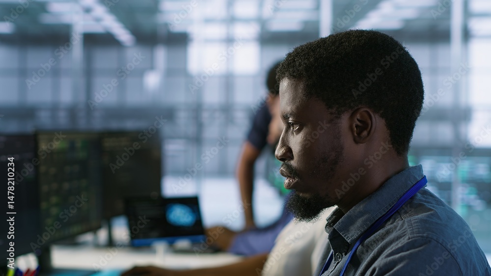 Poster focus on server hub employee developing disaster recovery plans ensuring minimal downtime. african a
