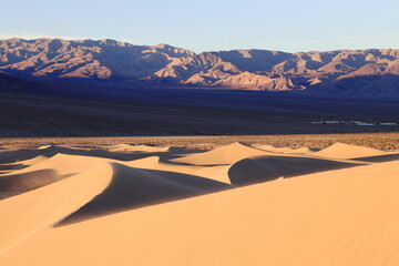 Fototapeta premium The Panamint mountains rise steeply at the edge of the Dune field in Death Valley, California