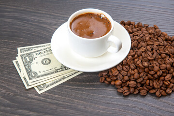 Enjoying a rich cup of coffee with fresh beans and a touch of cash on a wooden table. coffee business