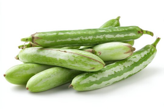 A pile of fresh green pointed gourds on a white background.