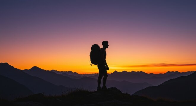Hiker silhouette at sunset mountain landscape - Powered by Adobe