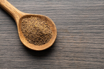 Aromatic black pepper on a spoon - Piper nigrum