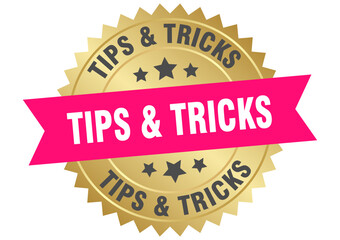 tips & tricks. tips & tricks round pink and gold label isolated on transparent background
