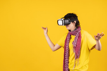 Woman interacting with virtual reality headset on yellow background