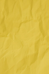 Crumpled yellow paper with wrinkled and textured background