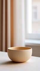 Fototapeta premium Simple bowl on table near window