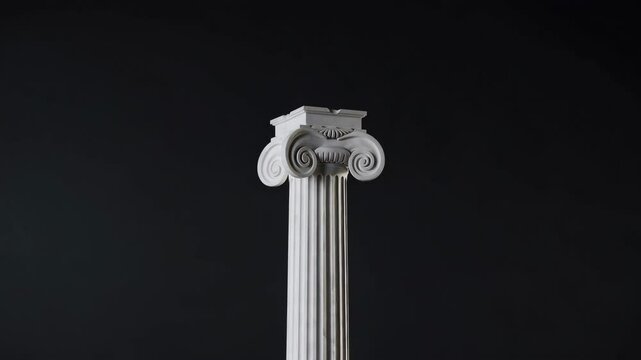 Rotating ionic column capital against dark background in high resolution