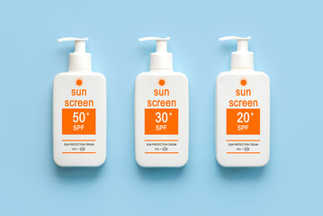 Top view of bottles of sunscreen with different spf numbers. Concept of sun protection