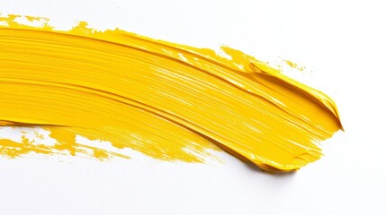 Vibrant Yellow Paint Stroke on White Canvas for Artistic Expression