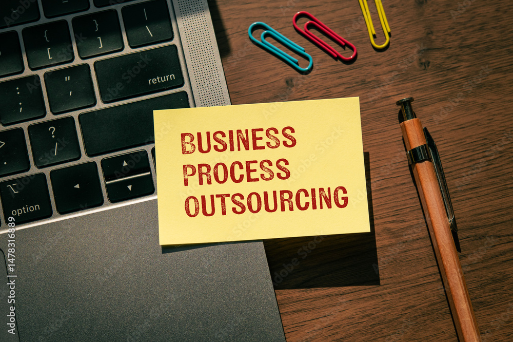Poster there is sticky note with the word business process outsourcing. it is as an eye-catching image.
