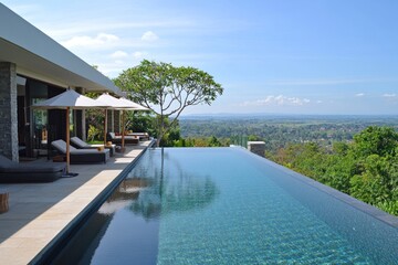 Fototapeta premium Serene infinity pool overlooking lush valley
