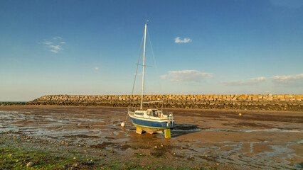 Boat in the mud during low tide