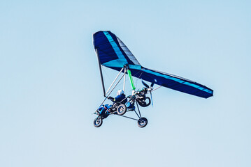 Hang glider flying in the sky.